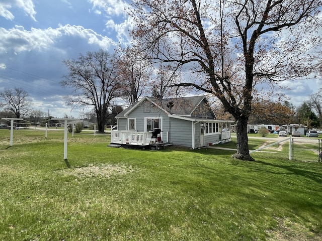 view of yard with fence and a deck