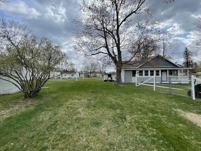 view of yard with covered porch