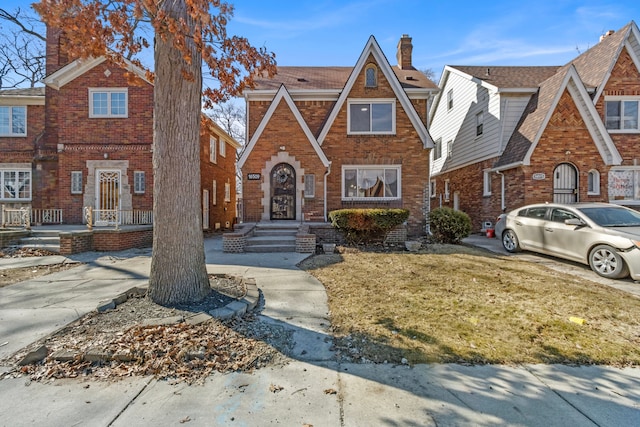 16509 Northlawn St, Detroit, MI 48221 - english style home with a chimney, a front yard, and brick siding