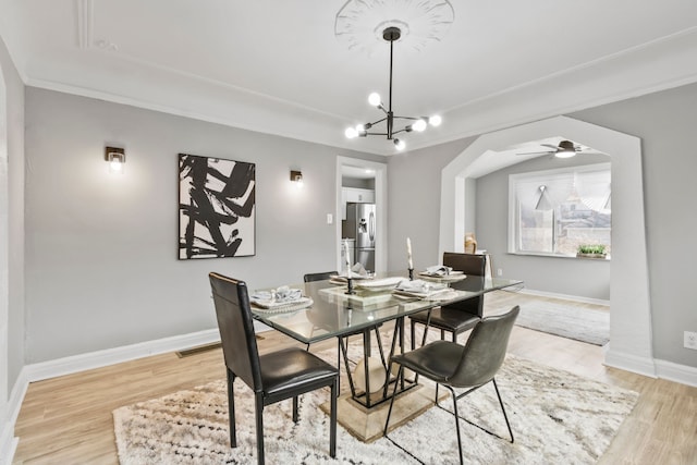 16509 Northlawn St, Detroit, MI 48221 - dining room featuring baseboards, ornamental molding, ceiling fan with notable chandelier, and light wood-style floors