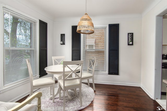 dining room with baseboards and wood finished floors