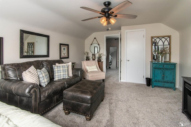 living area with light colored carpet, a ceiling fan, and lofted ceiling