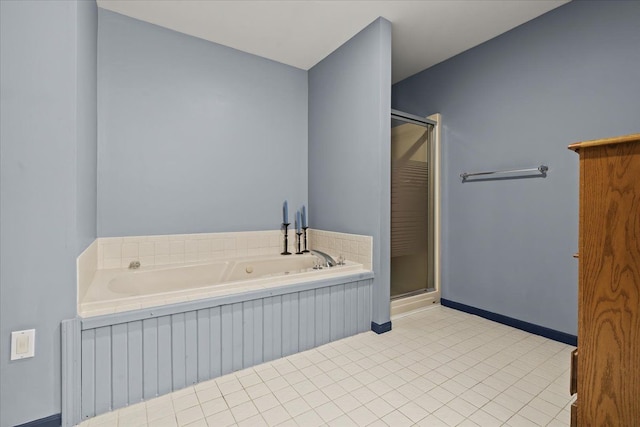 full bath featuring a tub with jets, baseboards, tile patterned flooring, and a shower stall
