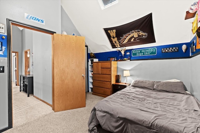 carpeted bedroom featuring visible vents and vaulted ceiling