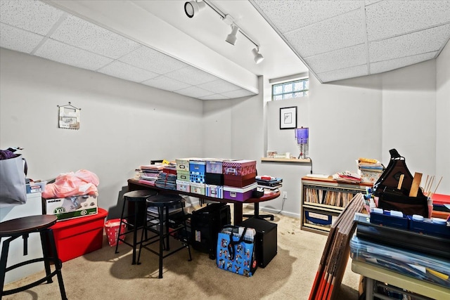 game room with carpet and a drop ceiling