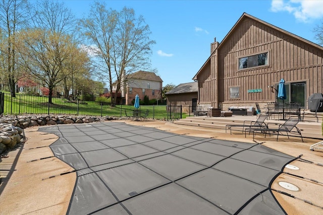 view of pool featuring a fenced in pool, a patio area, and fence
