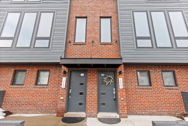 view of property with brick siding