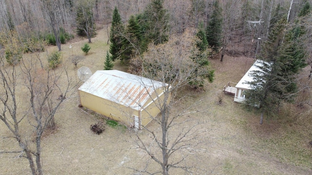 1837 9 Mile Rd, Sears, MI 49679 - view from above of property with a heavily wooded area