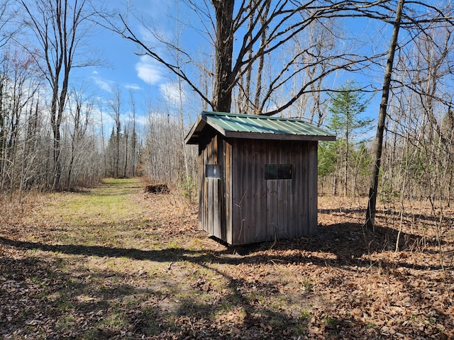 1837 9 Mile Rd, Sears, MI 49679 - view of shed with a view of trees