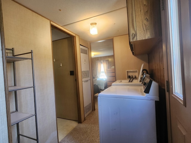 1837 9 Mile Rd, Sears, MI 49679 - washroom with cabinet space, washer and dryer, and a heating unit