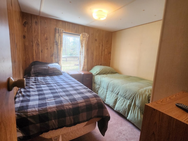 1837 9 Mile Rd, Sears, MI 49679 - bedroom featuring wooden walls and carpet flooring