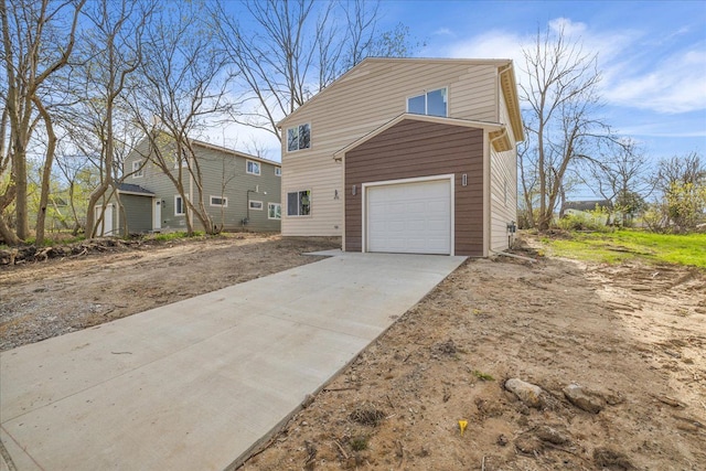 494 Bloomfield Ave, Pontiac, MI 48341 - view of home's exterior featuring a garage and concrete driveway