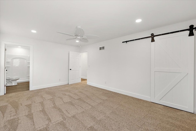494 Bloomfield Ave, Pontiac, MI 48341 - unfurnished bedroom with carpet, recessed lighting, a barn door, and visible vents
