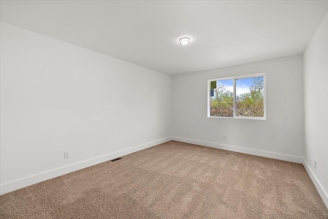 494 Bloomfield Ave, Pontiac, MI 48341 - empty room featuring baseboards, light carpet, and visible vents