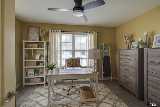 office area with carpet floors, ceiling fan, and baseboards