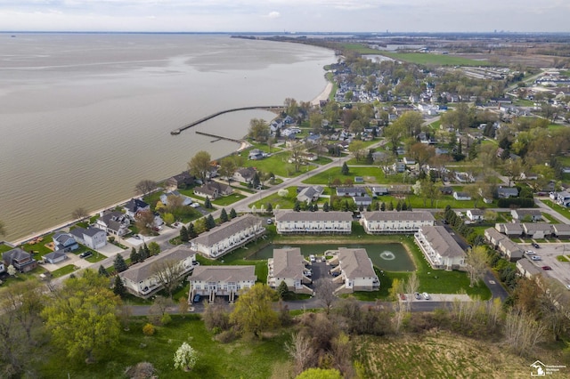 birds eye view of property featuring a water view and a residential view