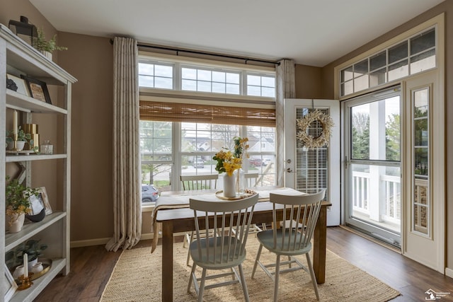 dining area with dark wood-type flooring