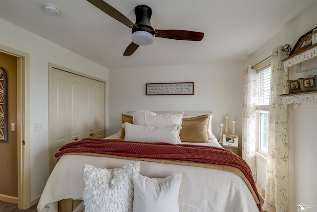 bedroom featuring a closet, baseboards, and a ceiling fan