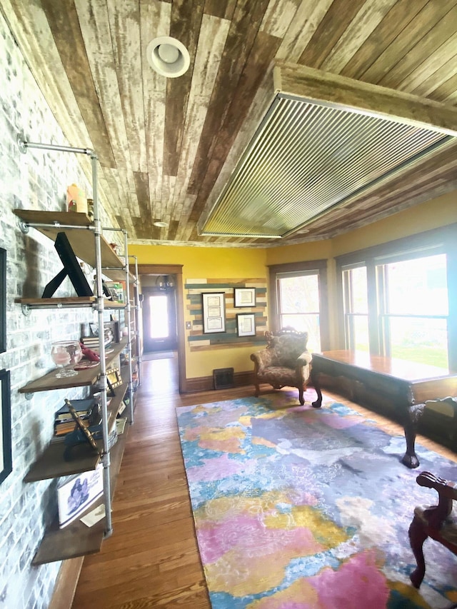 interior space with wood ceiling and wood finished floors