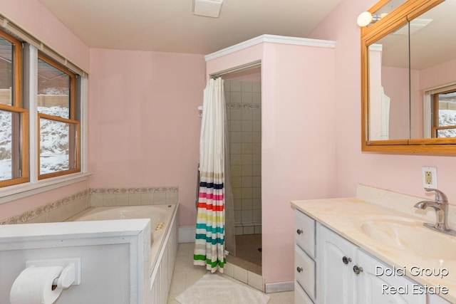 bathroom featuring vanity, tile patterned flooring, a tile shower, and a garden tub