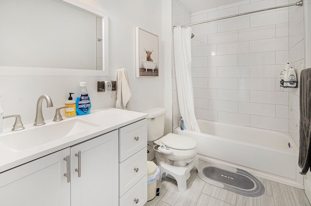 full bath featuring toilet, shower / bath combo, and vanity