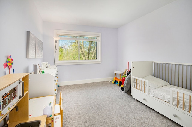 bedroom featuring baseboards and carpet flooring