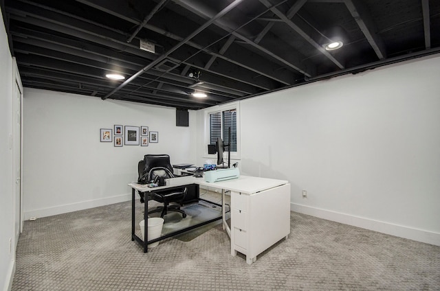 office space featuring baseboards and light colored carpet