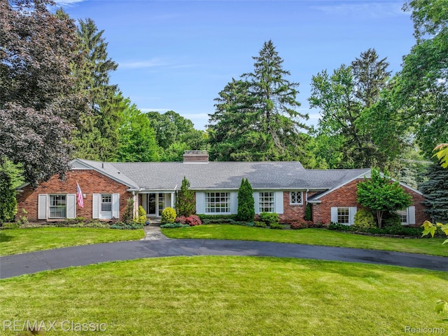 830 Jonathan Ln, Bloomfield Hills, MI 48302 - single story home featuring a front lawn, brick siding, a chimney, and french doors