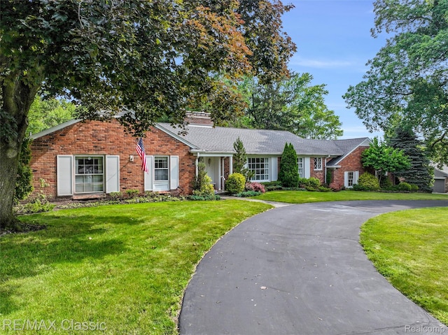 830 Jonathan Ln, Bloomfield Hills, MI 48302 - single story home with a front yard, a chimney, brick siding, and asphalt driveway