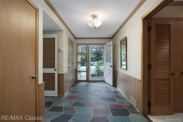830 Jonathan Ln, Bloomfield Hills, MI 48302 - entrance foyer featuring stone tile floors, wainscoting, and ornamental molding