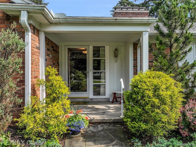 830 Jonathan Ln, Bloomfield Hills, MI 48302 - entrance to property with brick siding, covered porch, and a chimney