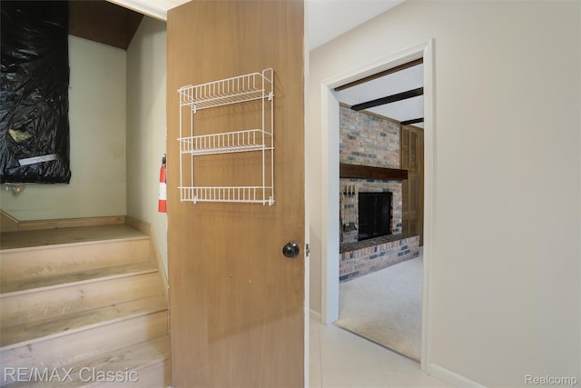 830 Jonathan Ln, Bloomfield Hills, MI 48302 - stairway featuring tile patterned floors, a fireplace, and carpet floors