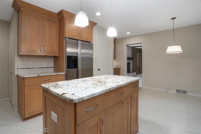 830 Jonathan Ln, Bloomfield Hills, MI 48302 - kitchen featuring stainless steel refrigerator with ice dispenser, recessed lighting, light stone countertops, a kitchen island, and tasteful backsplash