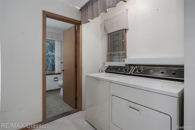 830 Jonathan Ln, Bloomfield Hills, MI 48302 - washroom with washer and dryer and light tile patterned floors