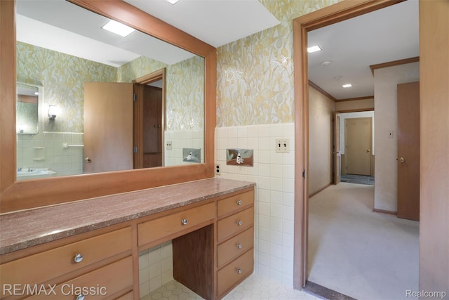 830 Jonathan Ln, Bloomfield Hills, MI 48302 - bathroom featuring wallpapered walls, tile walls, a wainscoted wall, and vanity