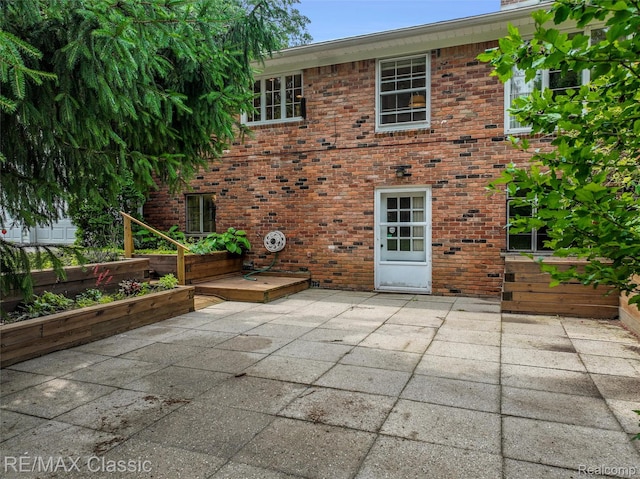 830 Jonathan Ln, Bloomfield Hills, MI 48302 - back of house with a patio and brick siding