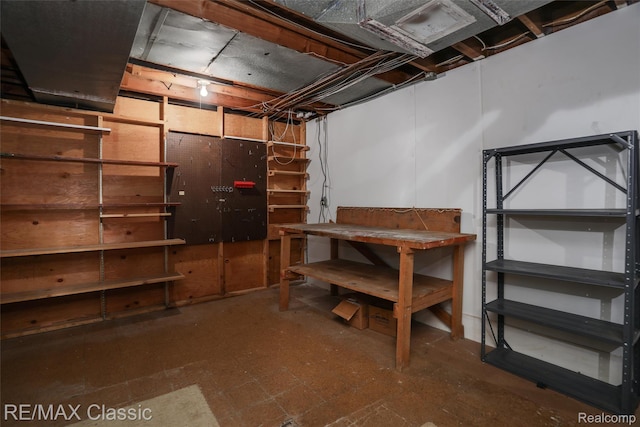 830 Jonathan Ln, Bloomfield Hills, MI 48302 - unfinished basement featuring a workshop area and tile patterned floors