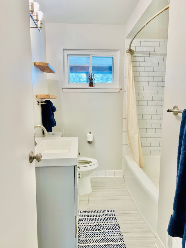 bathroom featuring toilet, shower / bathtub combination with curtain, and vanity