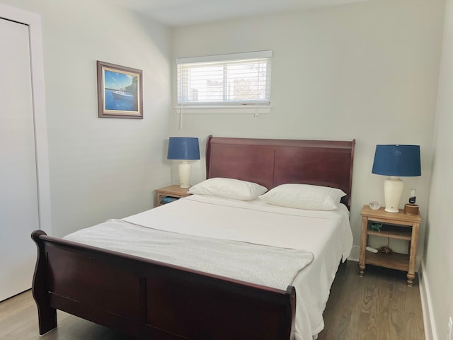 bedroom with wood finished floors