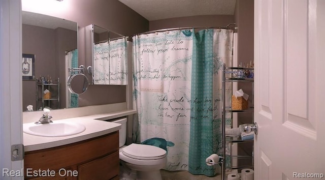 full bath with vanity, a textured ceiling, toilet, and curtained shower