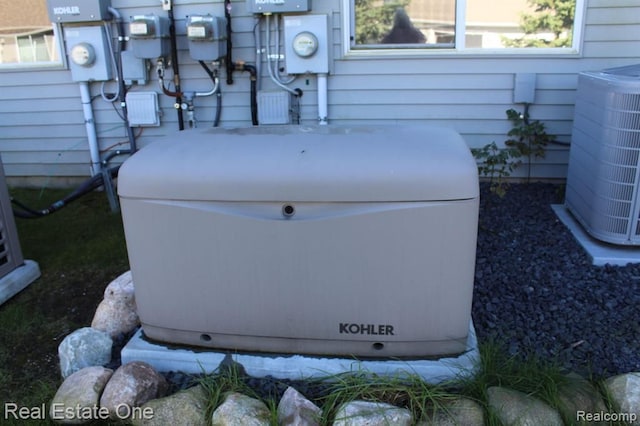 details with central air condition unit, a power unit, electric meter, and gas meter