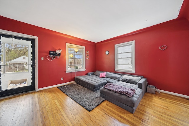 living room featuring baseboards and wood-type flooring