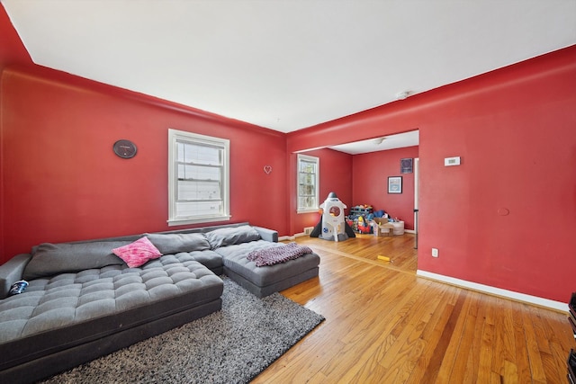 living room with baseboards and hardwood / wood-style flooring