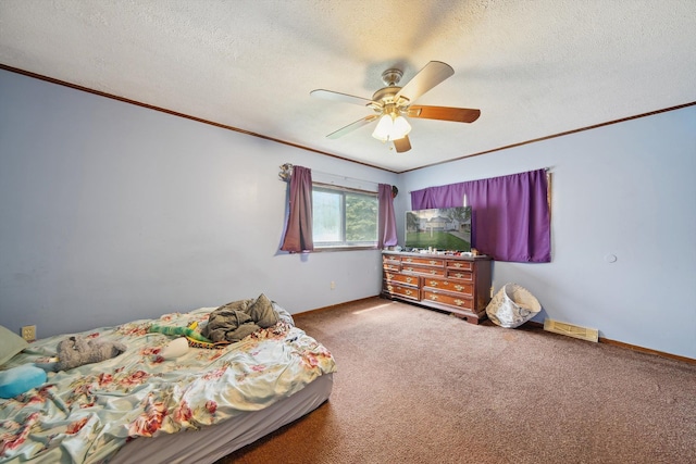 bedroom featuring crown molding, a textured ceiling, carpet, and baseboards