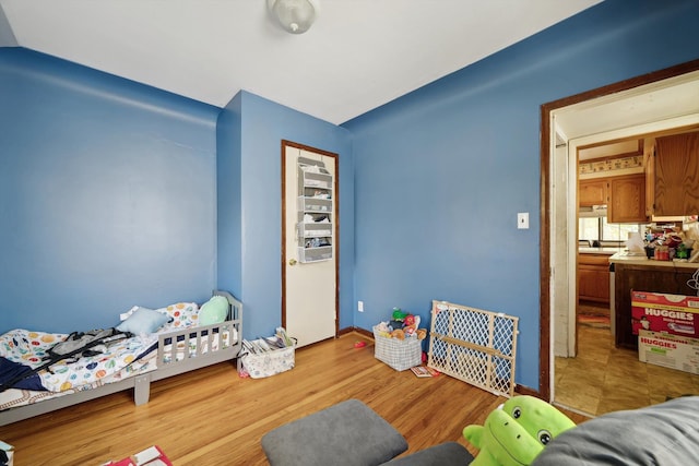 bedroom featuring light wood-type flooring