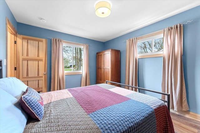 bedroom with wood finished floors