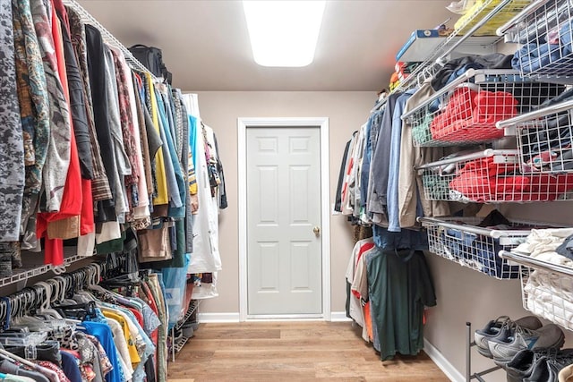 spacious closet with wood finished floors