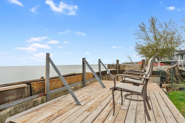 wooden terrace with a water view