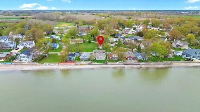 drone / aerial view with a residential view and a water view