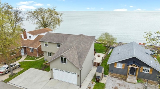 birds eye view of property with a water view